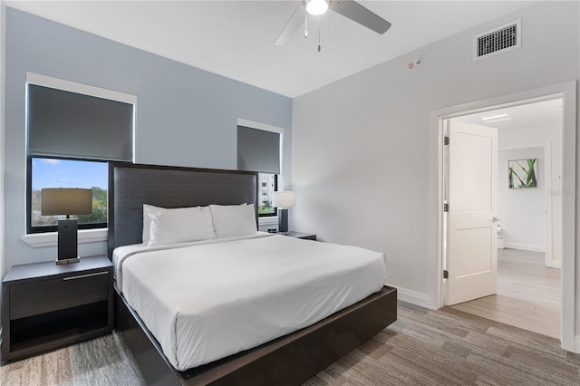 bedroom featuring hardwood / wood-style floors and ceiling fan