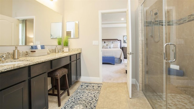 bathroom with vanity, tile patterned floors, and a shower with door