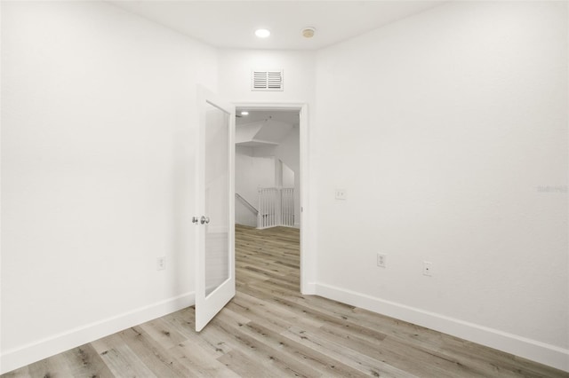 unfurnished room featuring light hardwood / wood-style flooring