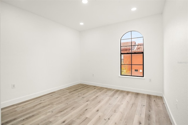 spare room with light hardwood / wood-style flooring