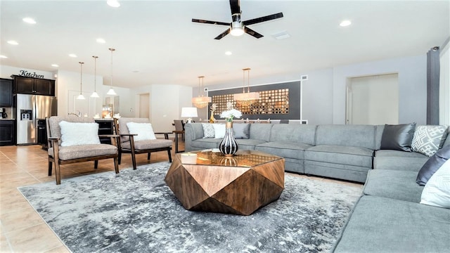 living room with ceiling fan and light tile patterned floors