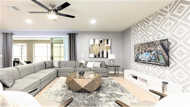 tiled living room with ceiling fan