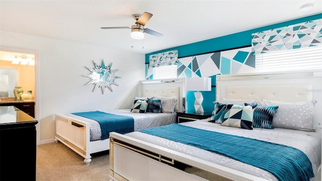 bedroom featuring light carpet and ceiling fan