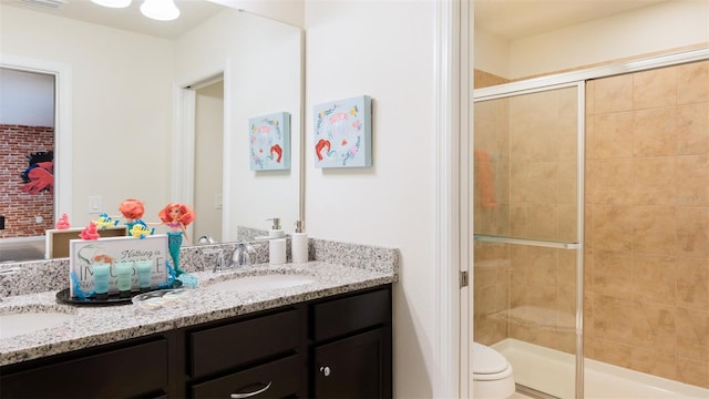 bathroom with vanity, toilet, and walk in shower