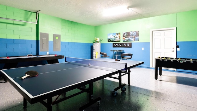 game room featuring a textured ceiling, electric panel, and electric water heater