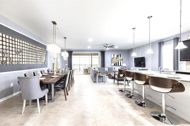 tiled dining area featuring ceiling fan