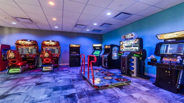 rec room featuring carpet flooring and a paneled ceiling