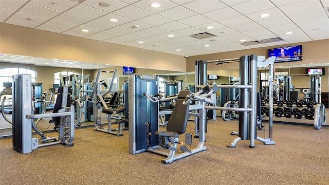 workout area with a paneled ceiling