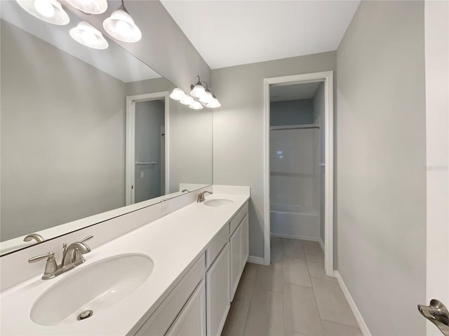 bathroom with tile patterned floors, vanity, and walk in shower