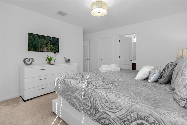 bedroom featuring light colored carpet