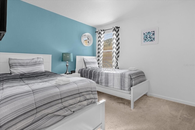 bedroom featuring light carpet