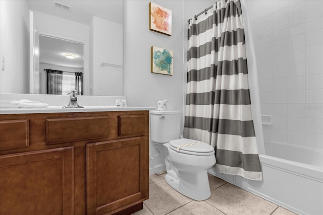 full bathroom with vanity, tile flooring, shower / bath combo with shower curtain, and toilet