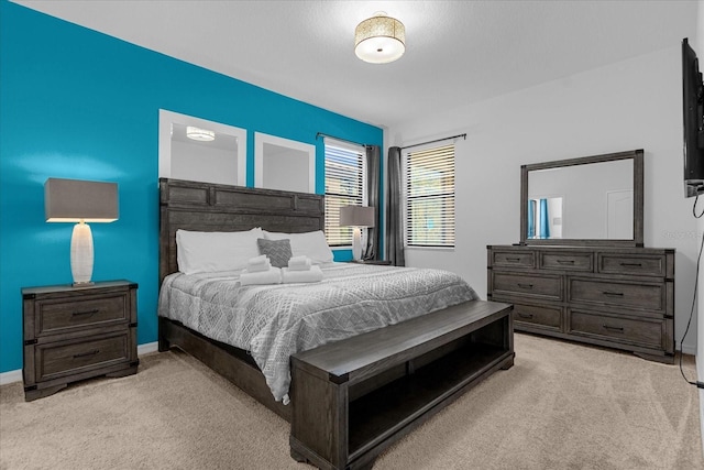 bedroom with light colored carpet