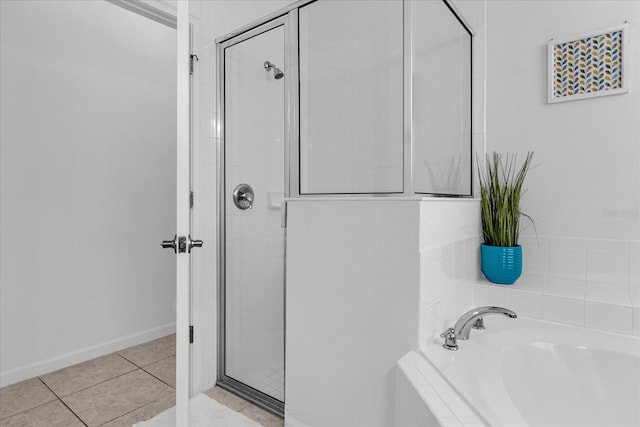 bathroom featuring tile floors and plus walk in shower