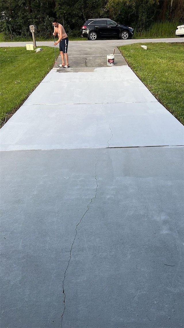 view of storm shelter with a lawn