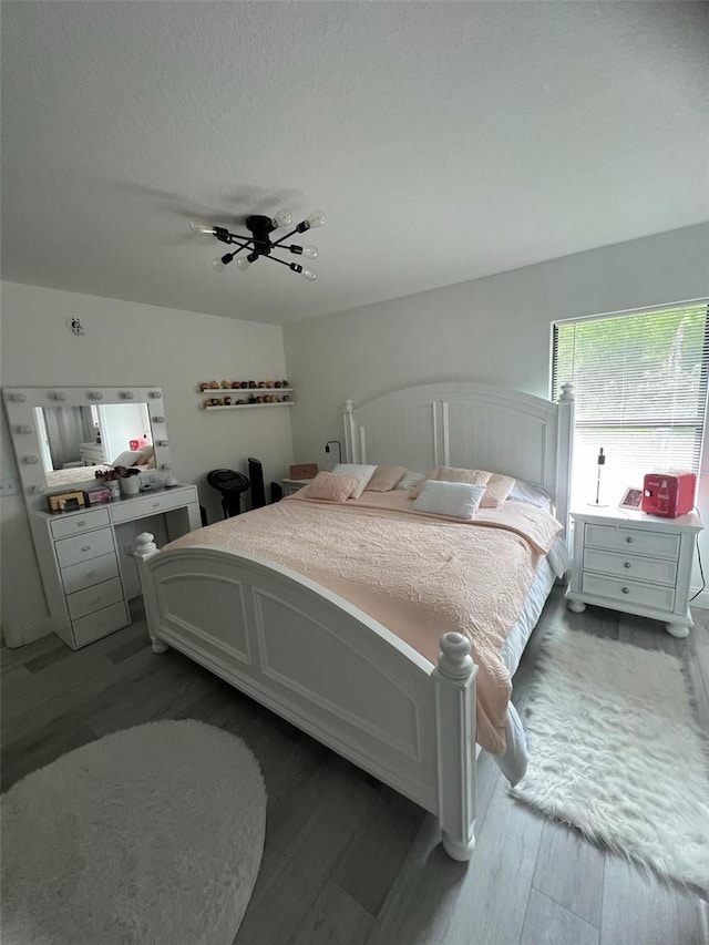 bedroom with wood-type flooring and ceiling fan