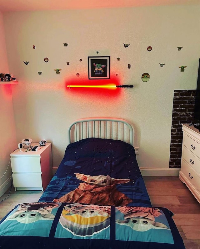 bedroom featuring wood-type flooring