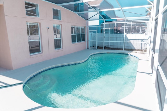 view of pool featuring a lanai