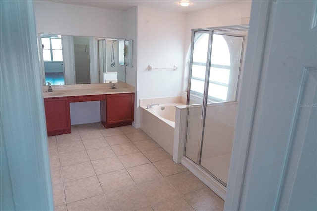 bathroom featuring tile patterned floors, a healthy amount of sunlight, shower with separate bathtub, and vanity