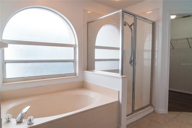 bathroom featuring tile patterned floors and plus walk in shower