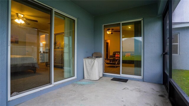 exterior space featuring a patio area and stucco siding