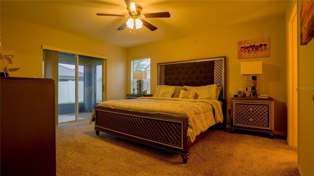 carpeted bedroom with access to outside and a ceiling fan