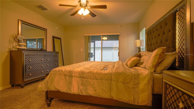 bedroom with carpet, visible vents, and ceiling fan