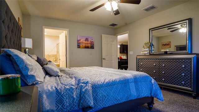 bedroom with ceiling fan, carpet flooring, visible vents, and ensuite bathroom