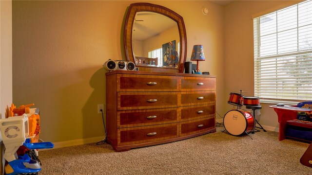 playroom featuring carpet floors and baseboards