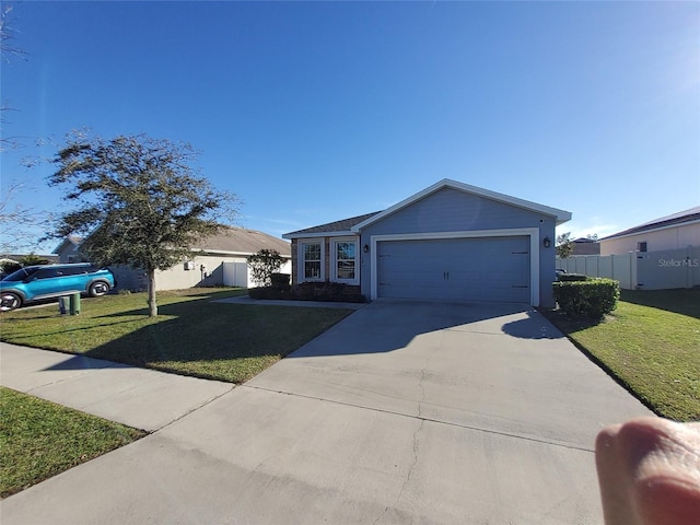 ranch-style house featuring a garage, driveway, a front yard, and fence