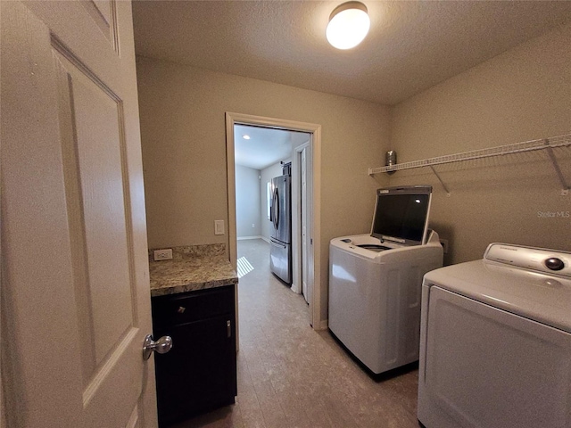 laundry room featuring washing machine and clothes dryer