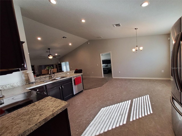 kitchen featuring dishwasher, open floor plan, black electric stovetop, vaulted ceiling, and a sink