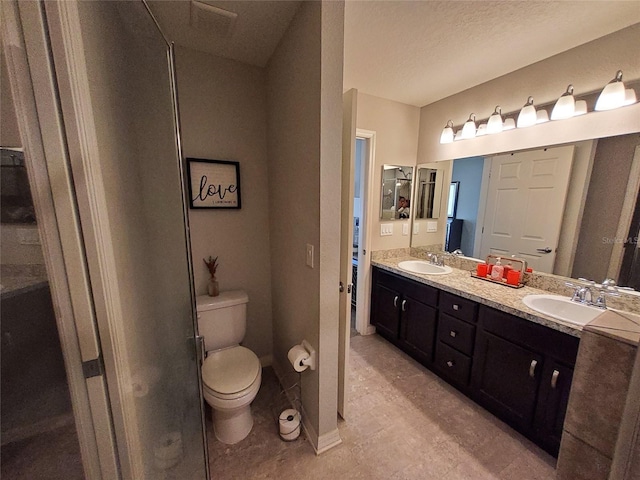 full bath with double vanity, a sink, and toilet