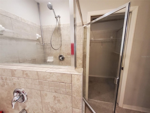 bathroom with a tile shower