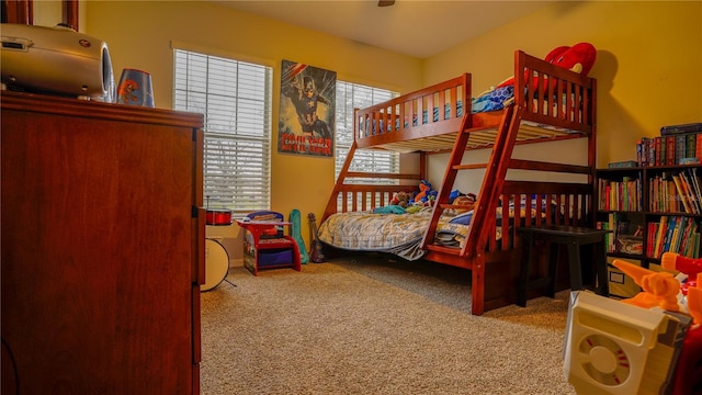 carpeted bedroom with multiple windows