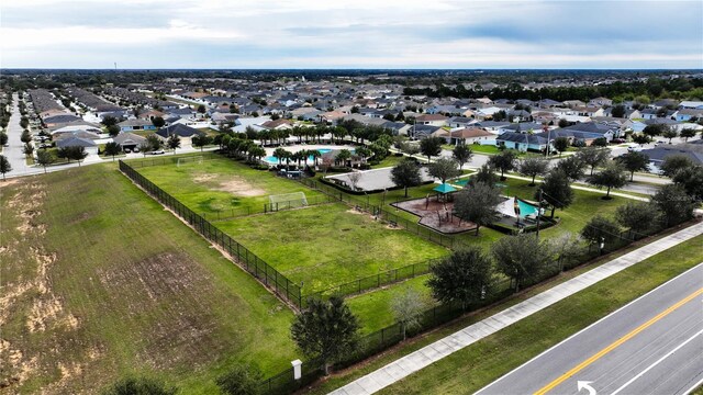 birds eye view of property with a residential view