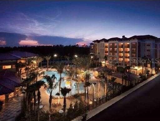 view of pool at dusk