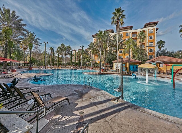 view of pool featuring pool water feature, a gazebo, and a patio