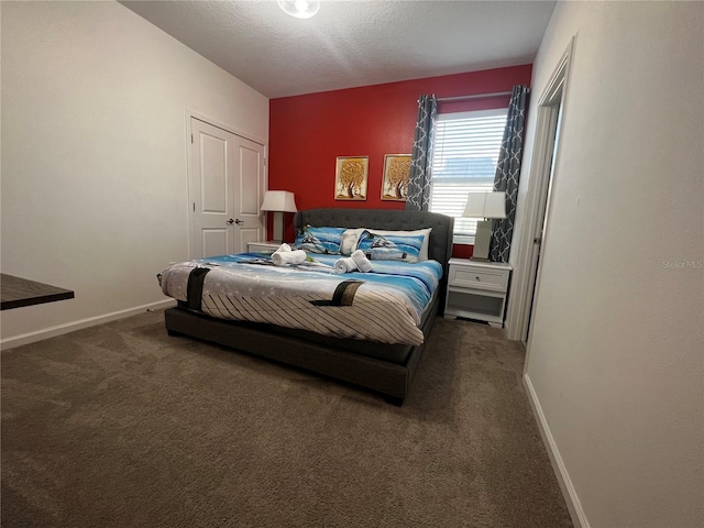 carpeted bedroom with a textured ceiling