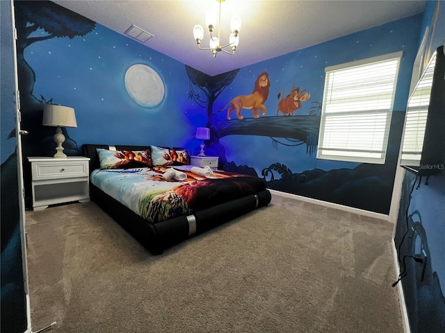 bedroom featuring a chandelier and carpet