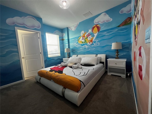 carpeted bedroom featuring a textured ceiling