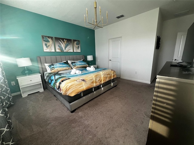 carpeted bedroom with a notable chandelier