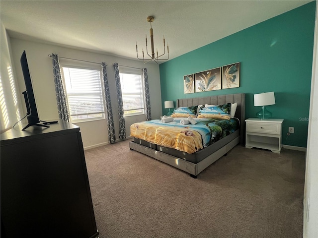 bedroom with an inviting chandelier and carpet floors