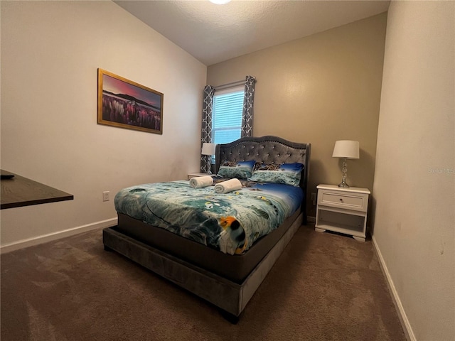 carpeted bedroom with vaulted ceiling