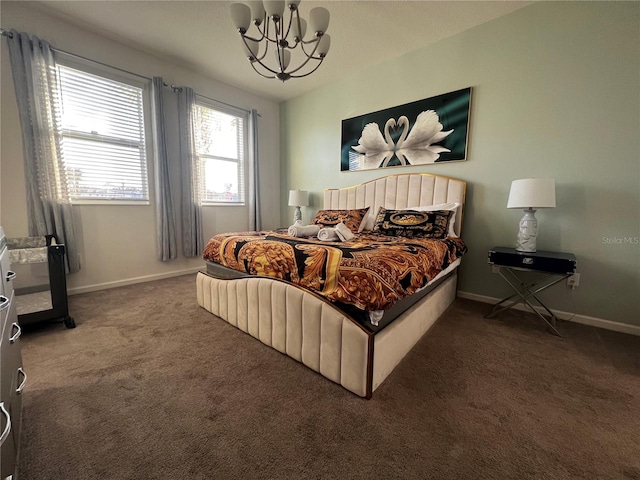 carpeted bedroom featuring a chandelier