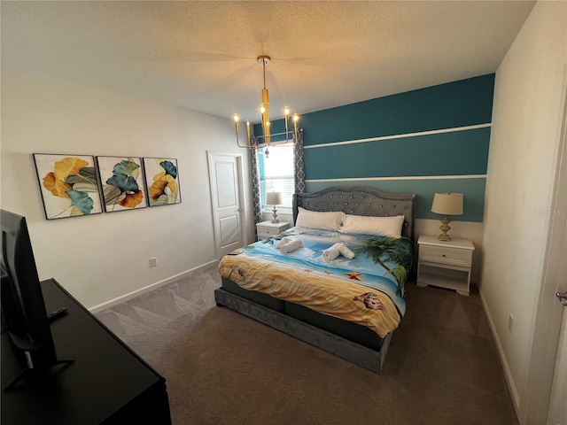 bedroom with a chandelier, a textured ceiling, and carpet floors