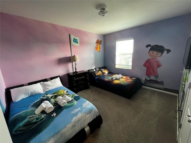 bedroom featuring a textured ceiling and carpet flooring