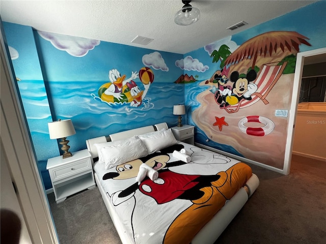 bedroom featuring a textured ceiling and carpet flooring