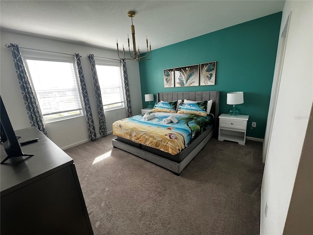 bedroom with an inviting chandelier, carpet, and a textured ceiling