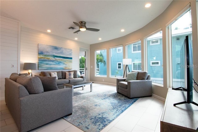 living room featuring ceiling fan and light tile patterned flooring